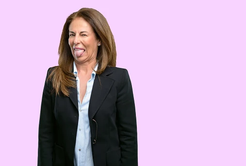 Middle age business woman feeling disgusted with tongue out