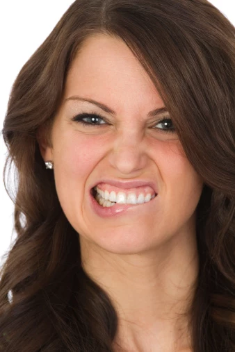 woman making funny face, on white background